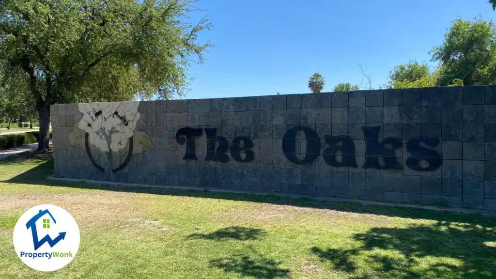 Signage at the entrance to the The Oaks neighborhood in Bakersfield.