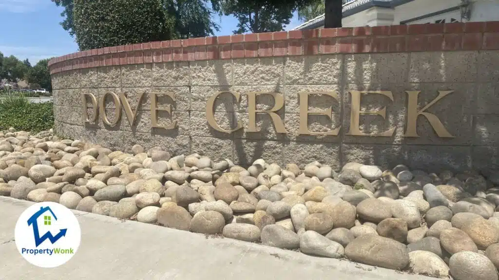 Signage at the entrance to the Dove Creek - Country Rose neighborhood in Bakersfield.