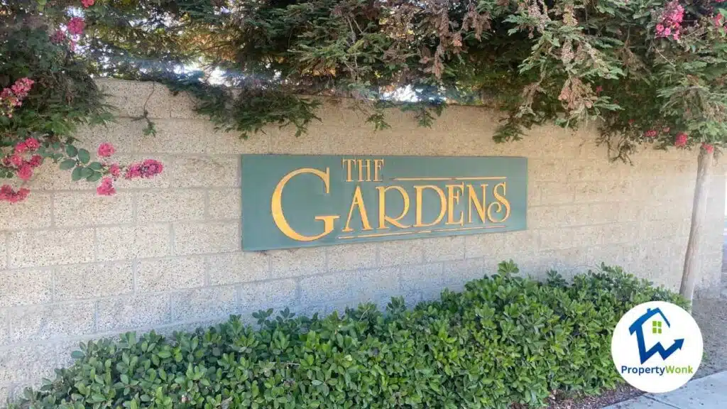 Signage at the entrance to the The Gardens neighborhood in Bakersfield.