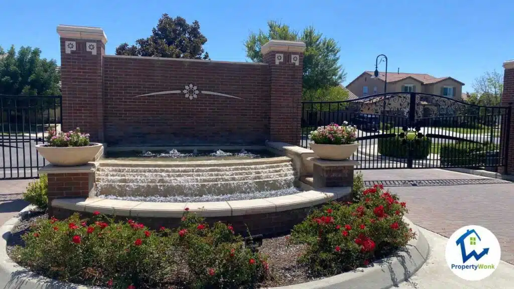 Gate at the entrance to the Village Green neighborhood in Bakersfield.